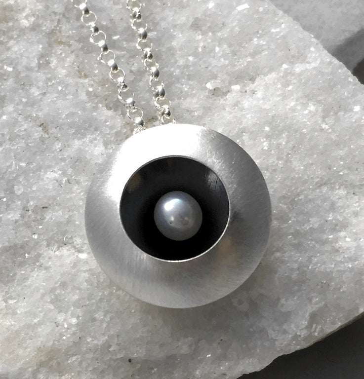 EMMA TALLACK JEWELRY —  Handcrafted Double-Domed, Brushed Sterling Silver and White Button Pearl Pendant / Necklace with Oxidized Center — 1.5 centimeters